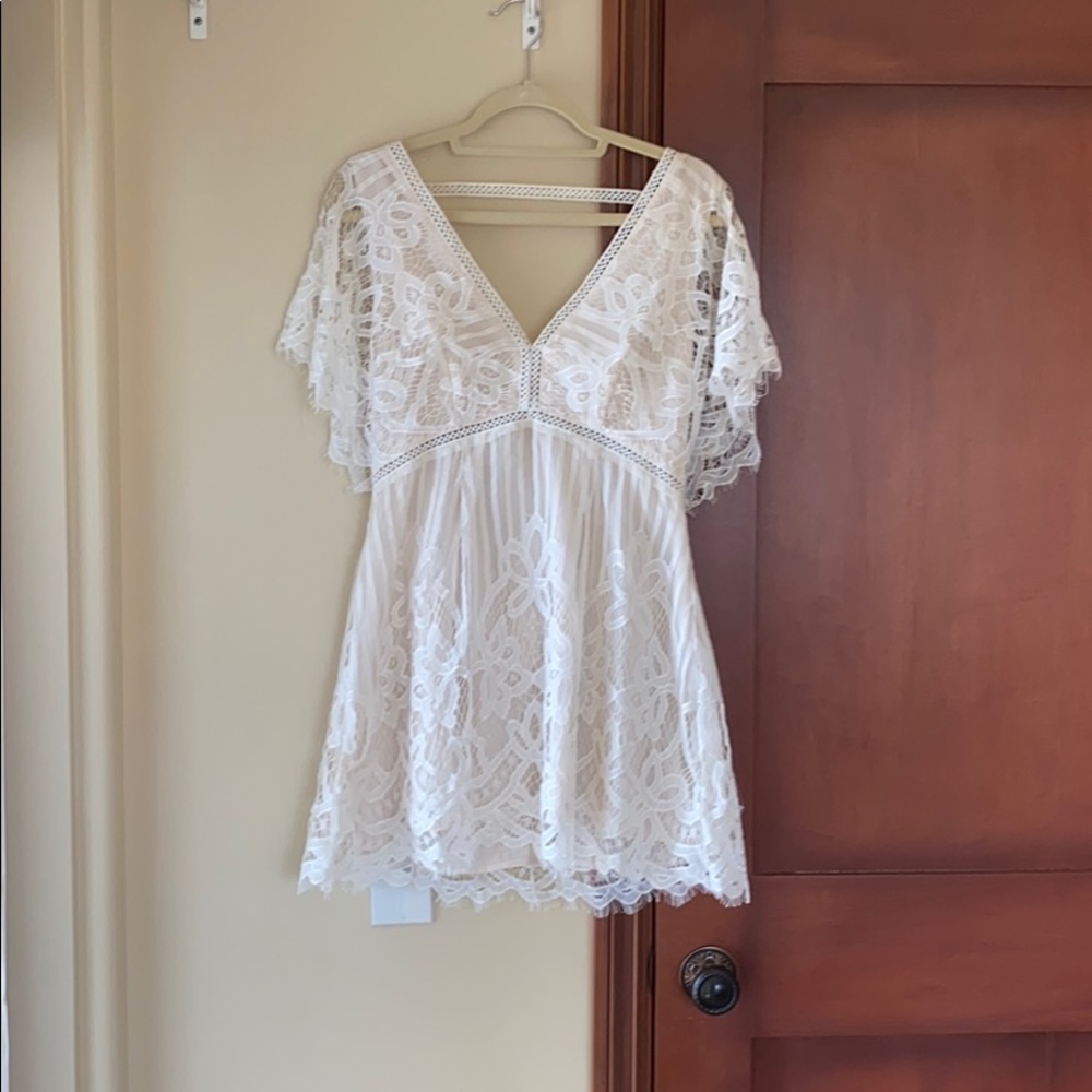 white loose flows dress, deep v and backless